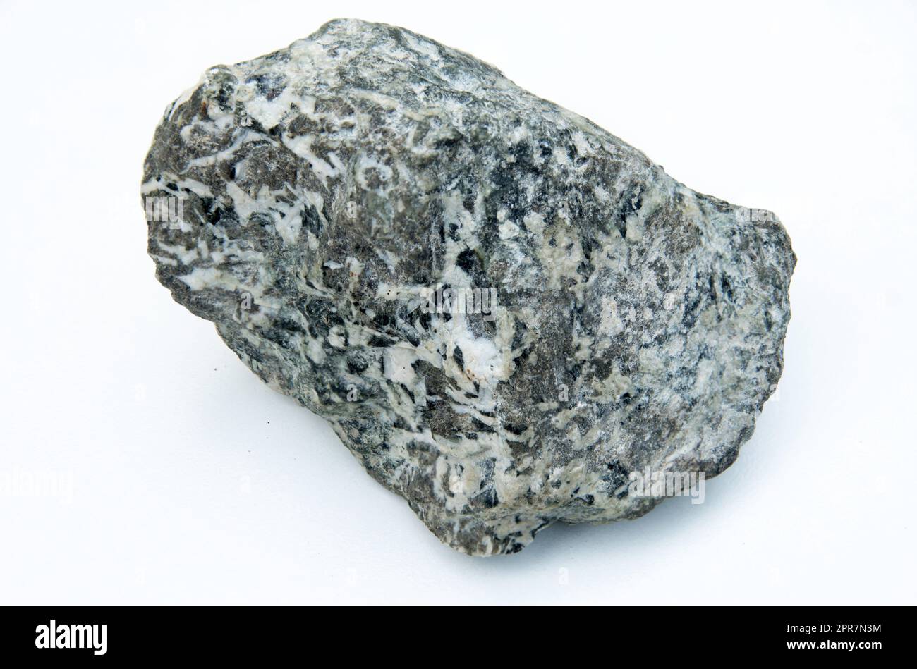 roccia ignea su sfondo bianco Foto Stock