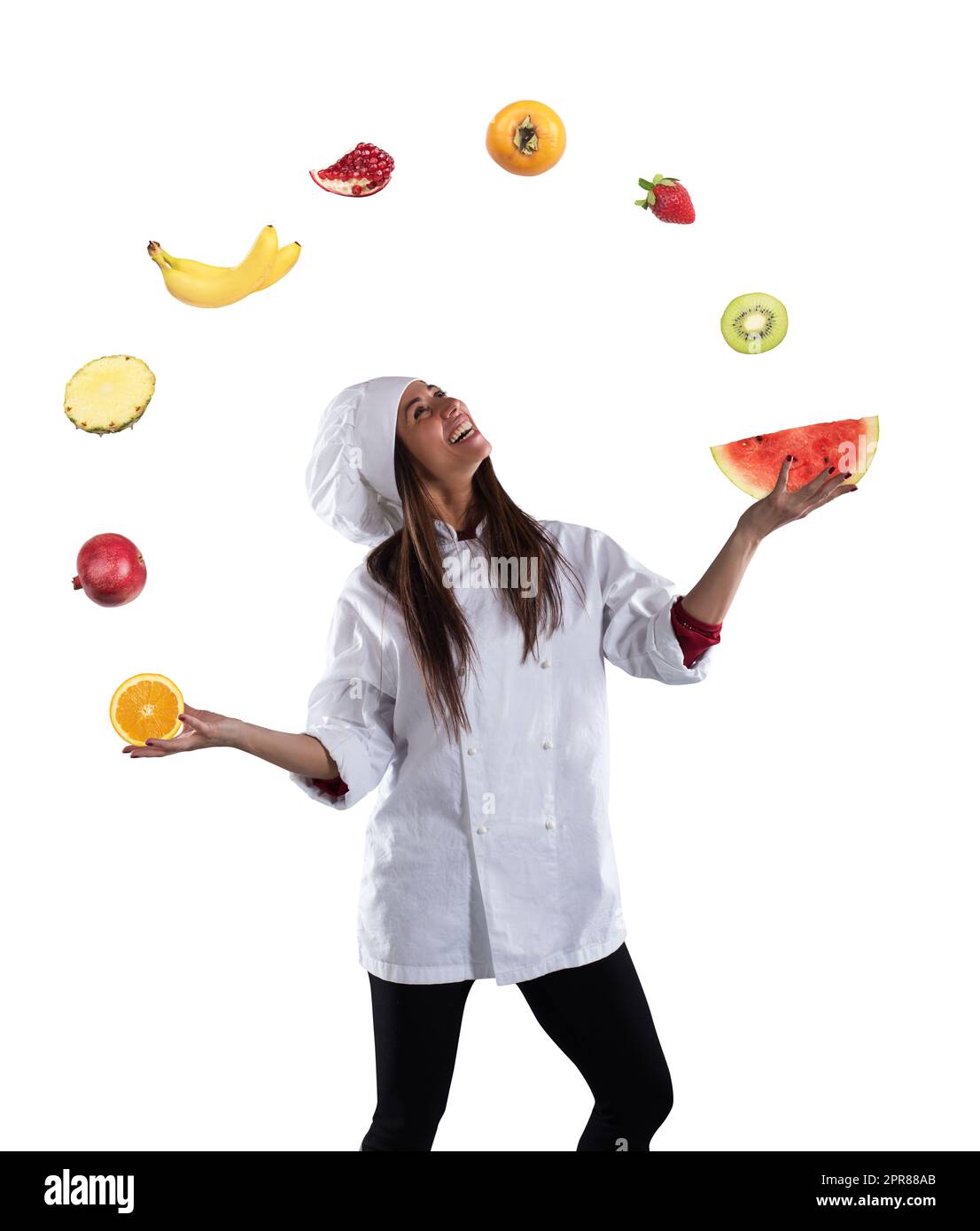 Donna chef prepara una nuova ricevuta con frutta Foto Stock