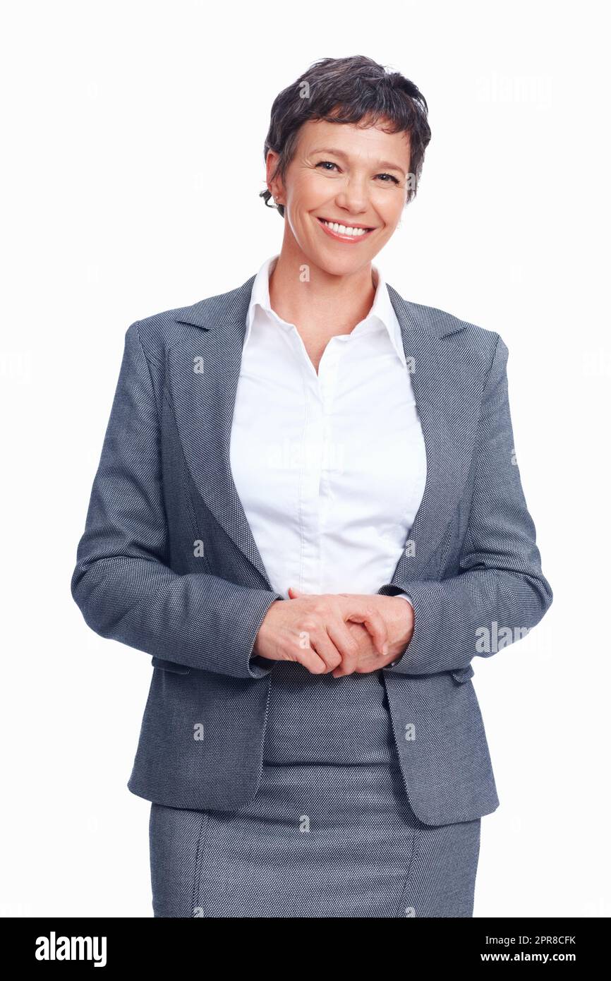 Felice donna d'affari. Sorridente donna di affari matura in piedi su sfondo bianco. Foto Stock