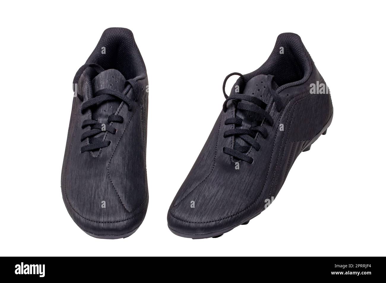 Primo piano di un paio di scarpe da calcio in pelle nera isolate su sfondo bianco. Scarpe da ginnastica professionali per ragazzi. Scarpe sportive. Foto Stock