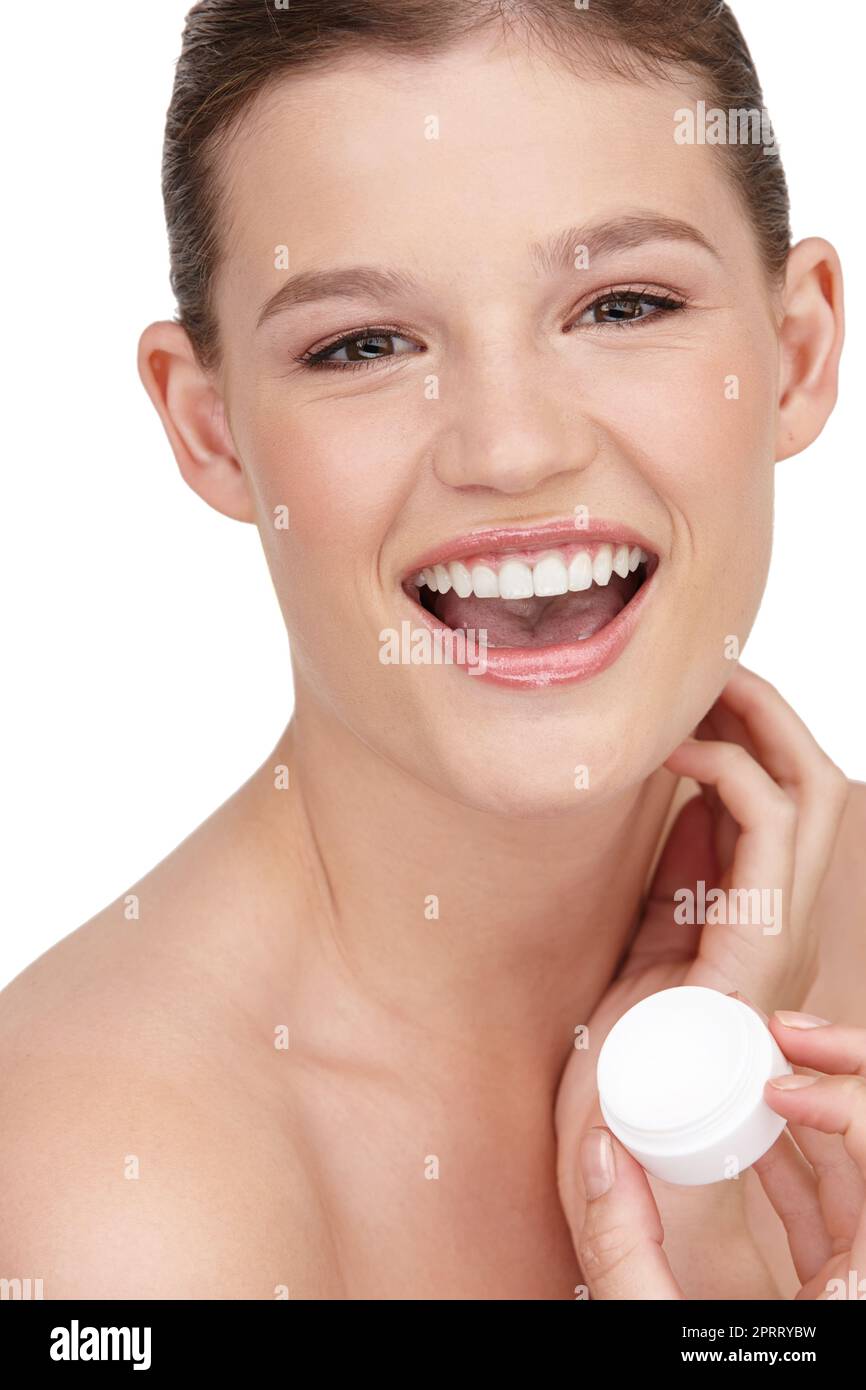 Per una pelle chiara. Primo piano shot di una bella ragazza adolescente in possesso di una vasca di idratante. Foto Stock