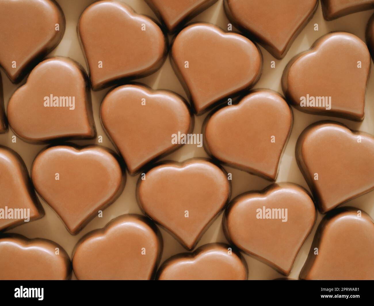 Motivo dolciumi a cuori di cioccolato, flatlay Foto Stock