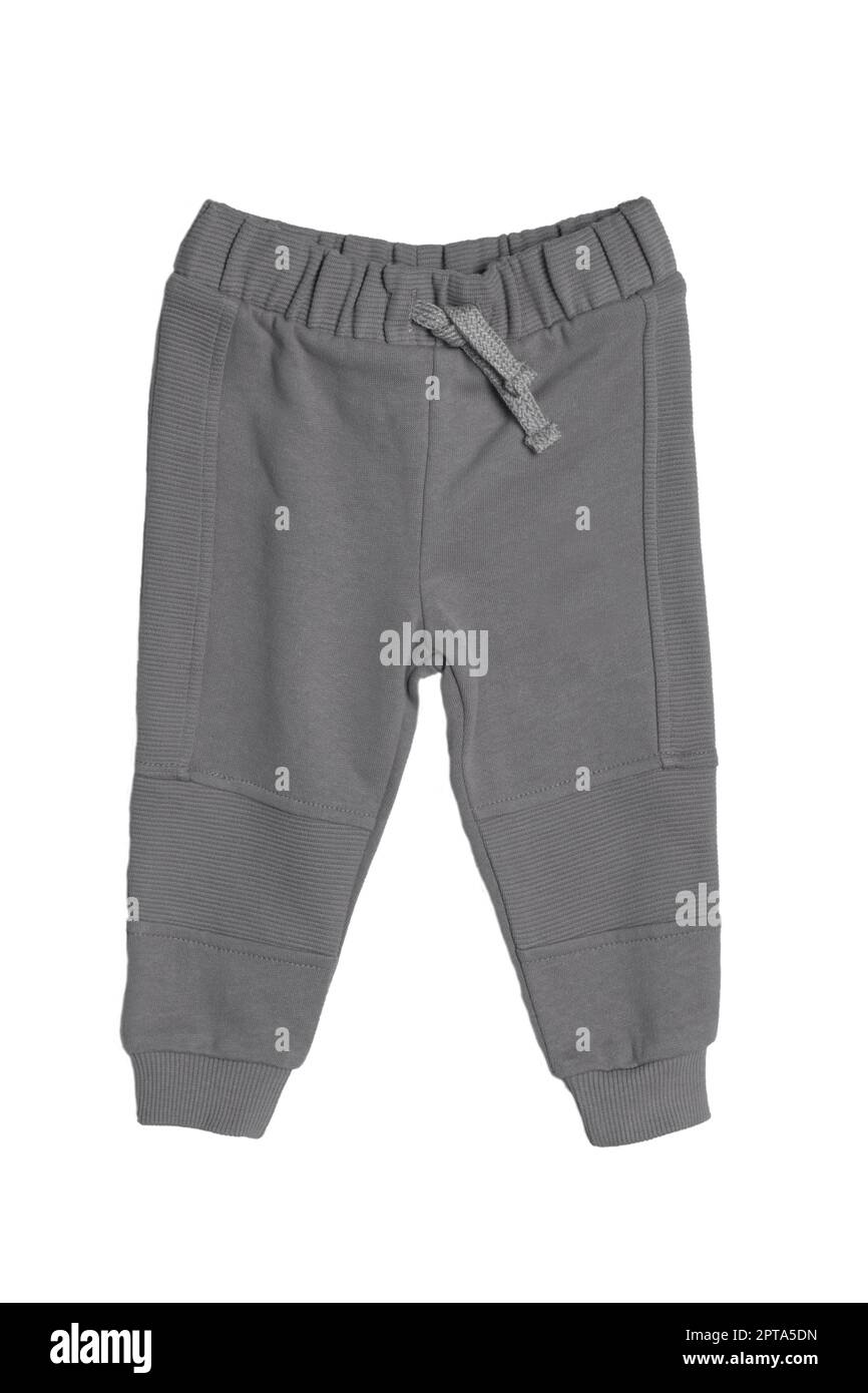 Abbigliamento sportivo per bambini. Primo piano di un bambino grigio sport pantaloni felpa isolato su sfondo bianco. Pantaloni moda primavera e autunno per bambini. Foto Stock