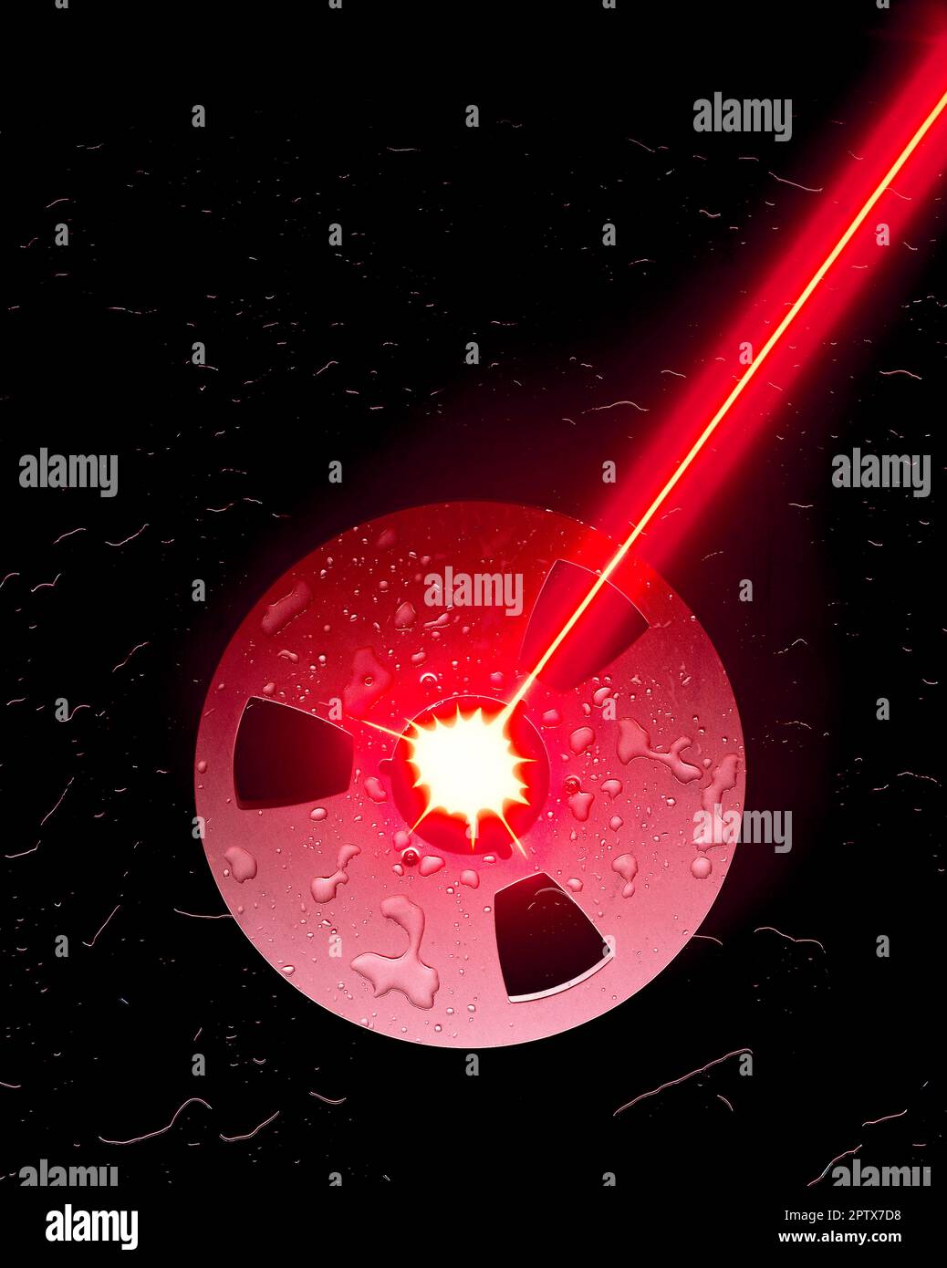 Concetto fermo-vita. Raggio laser che colpisce la bobina del nastro di registrazione. Foto Stock