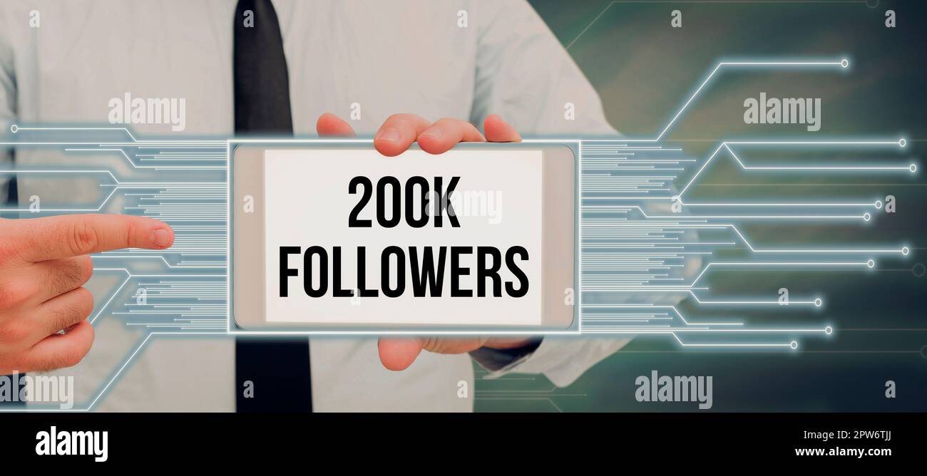 Segno di scrittura della mano 200K seguaci, parola per il numero di individui che seguono qualcuno dentro Foto Stock