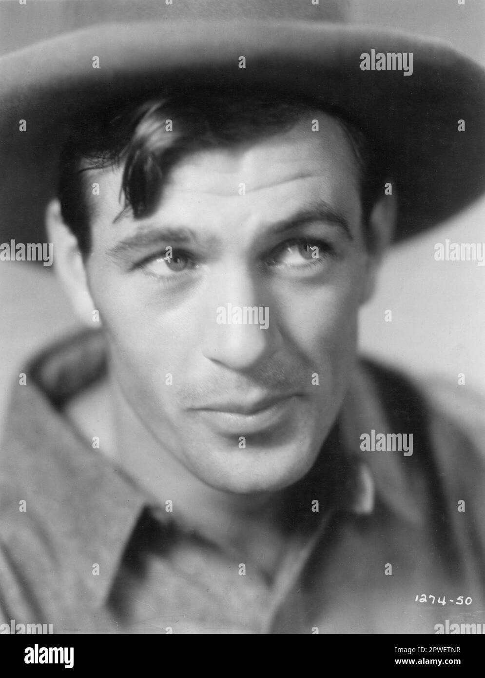 Ritratto WESTERN dell'attore americano GARY COOPER in THE SPOILERS 1930 regista EDWARD CAREWE Book REX BEACH Paramount Pictures Foto Stock