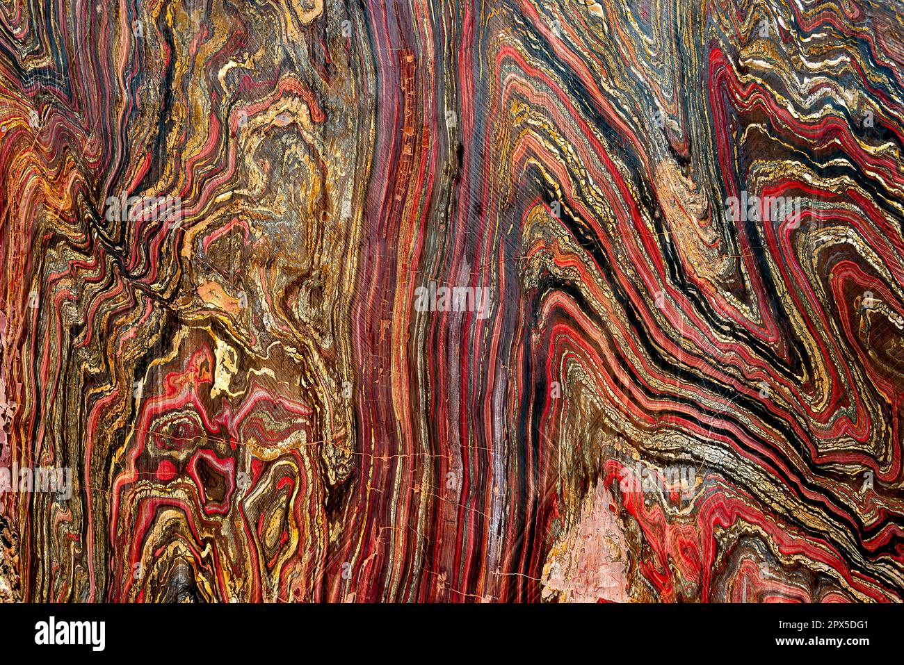 Il motivo colorato di un taglio e di un ferro da stiro lucido liscio in una vista ravvicinata Foto Stock