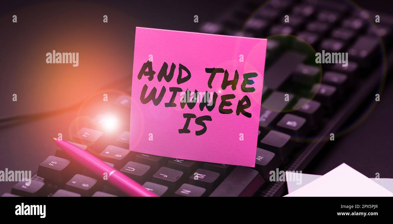 Conceptual caption And The Winner Is, Word Written on written spoken results of short quiz or exam on the internet Foto Stock