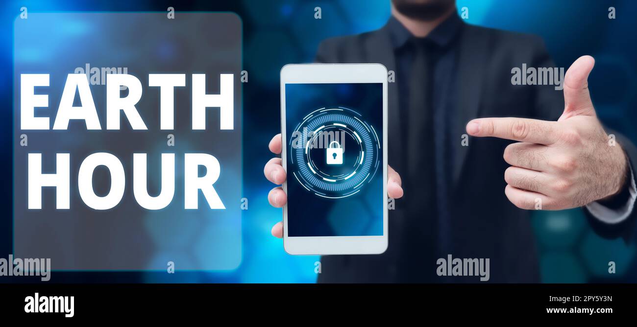 Scrittura a mano del testo Earth Hour. Panoramica delle imprese movimento globale per chiedere un'azione più incisiva sul cambiamento climatico Foto Stock