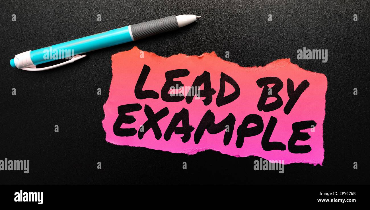 Didascalia concettuale Lead by Example. Parola per essere un leader mentore seguire le regole dare esempi Coach Foto Stock