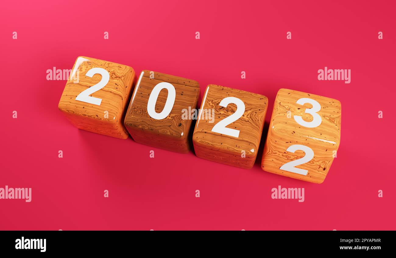 Cubi di legno capovolti con i numeri degli anni 2022 e 2023 su sfondo magenta Foto Stock