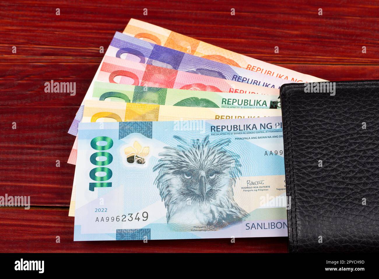 Philippine peso nel portafoglio nero Foto Stock