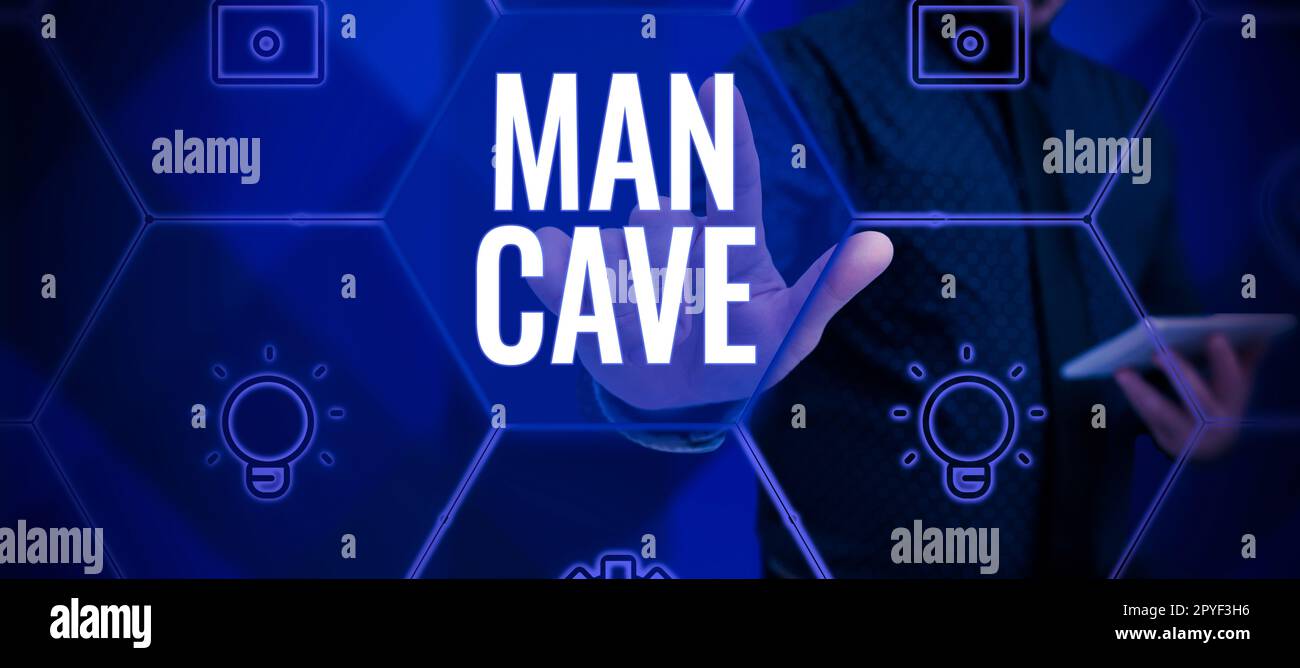 Cartello con scritta Man Cave. Business Overview una stanza, uno spazio o un'area di un'abitazione riservata a un maschio Foto Stock