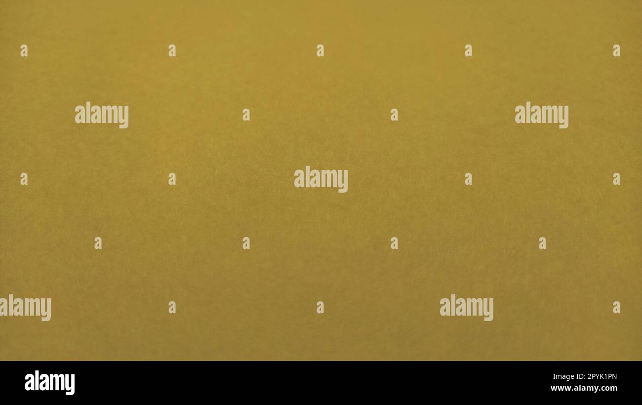 Bel fondo giallo. Primo piano di un foglio di carta. Colore puro e allegro. Sfumatura di giallo, simile all'ocra o marrone senza lucentezza Foto Stock