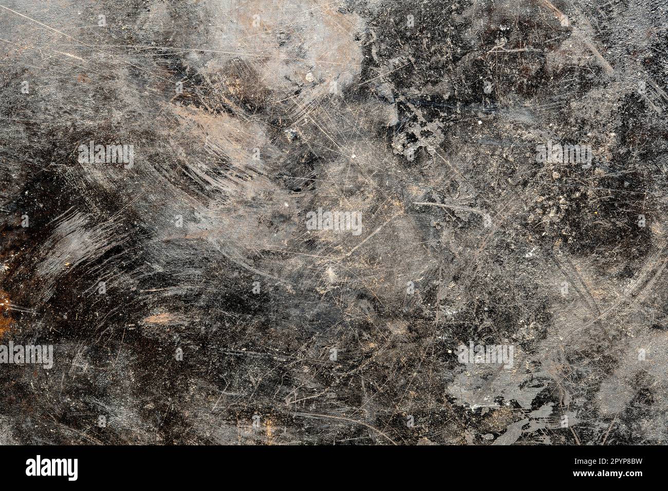 Grunge vecchio sfondo di metallo nero o texture con graffi e crepe, primo piano, vista dall'alto Foto Stock