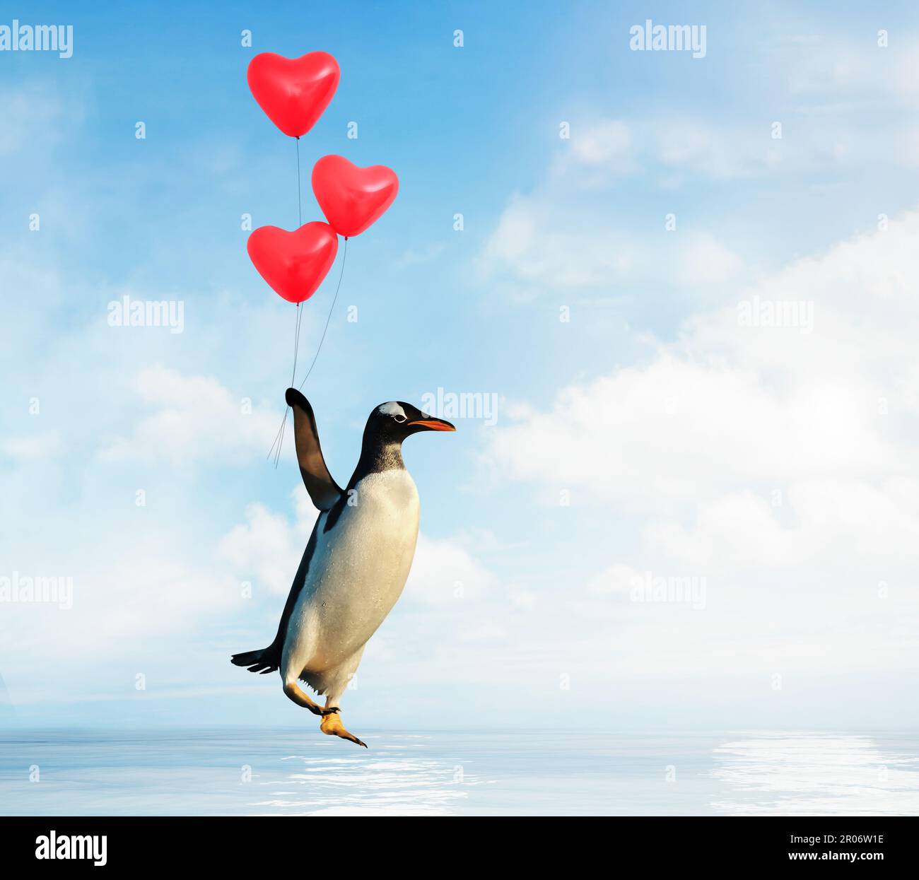 Primo piano di un pinguino che vola con palloncini a forma di cuore rosso sull'acqua. Foto Stock