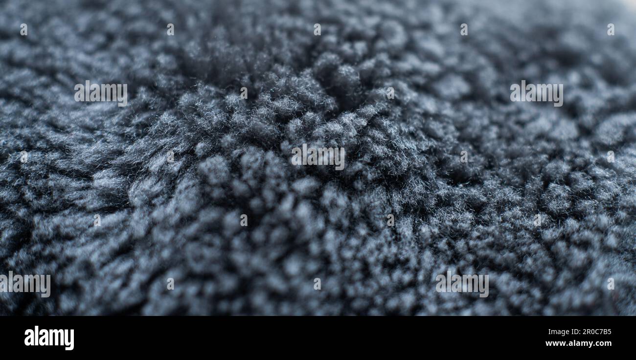 Primo piano di tessuto in pelliccia di lana di colore grigio Foto Stock
