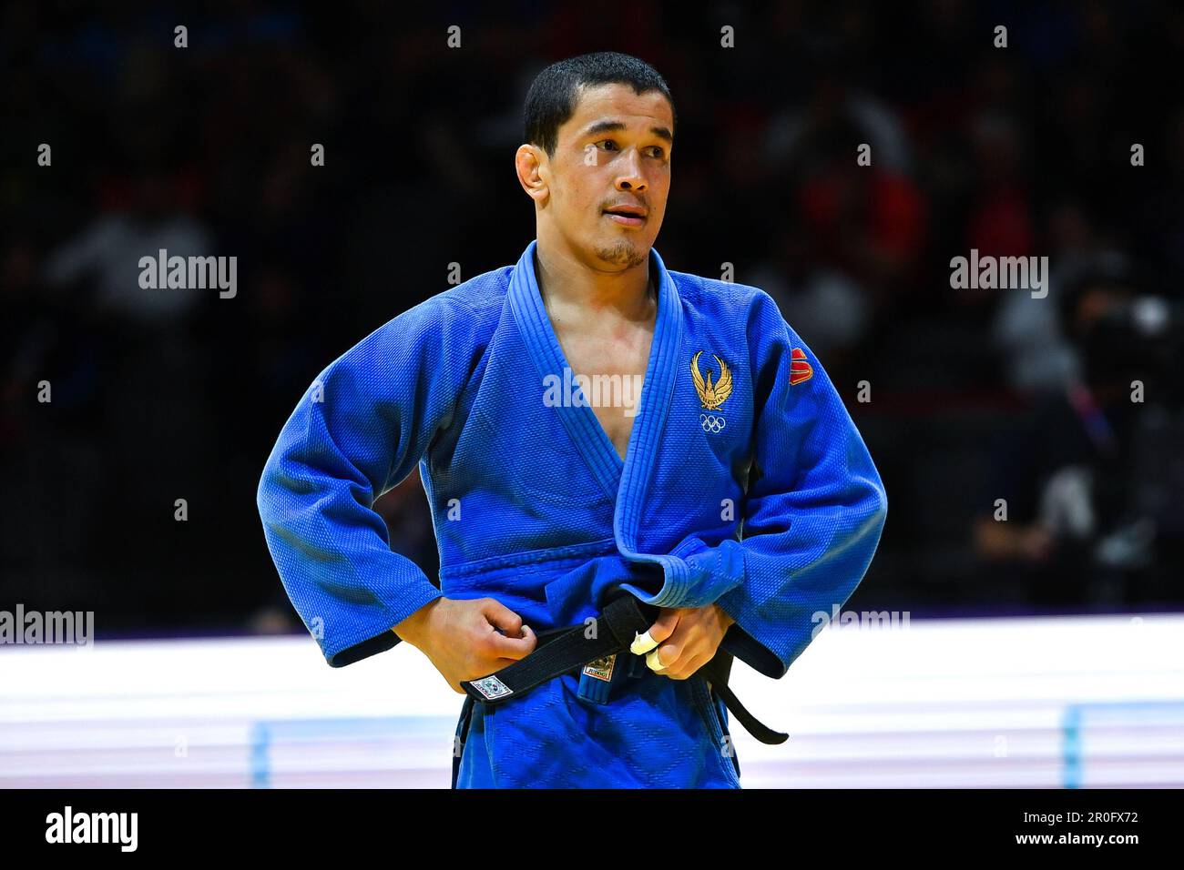 Doha, Qatar, 7 maggio 2023. Dilshodbek Baratov dell'Uzbekistan reagisce