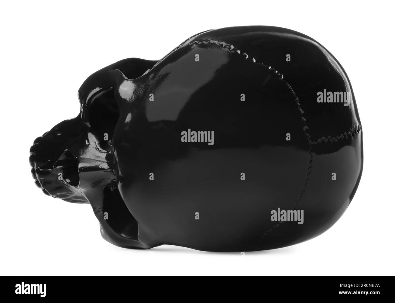 Cranio umano lucido nero isolato su bianco Foto Stock
