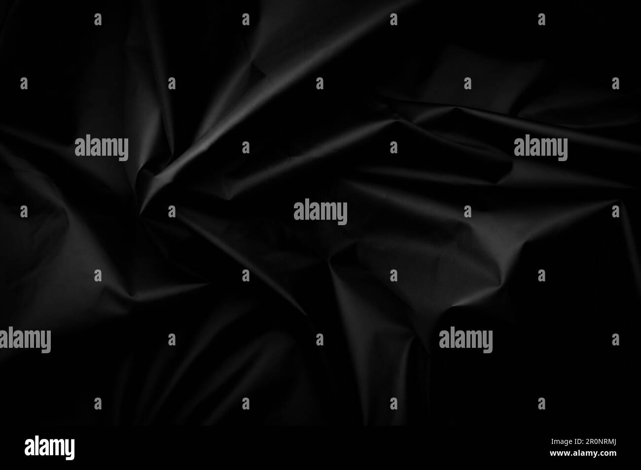 Tessuto in nylon nero. tessuto sfaldabile minimalista ed elegante. semplice sfondo scuro Foto Stock