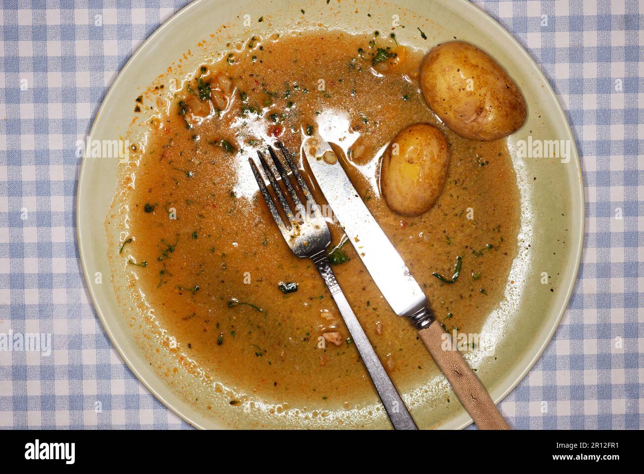 Mangiato con gli avanzi di patate Foto Stock