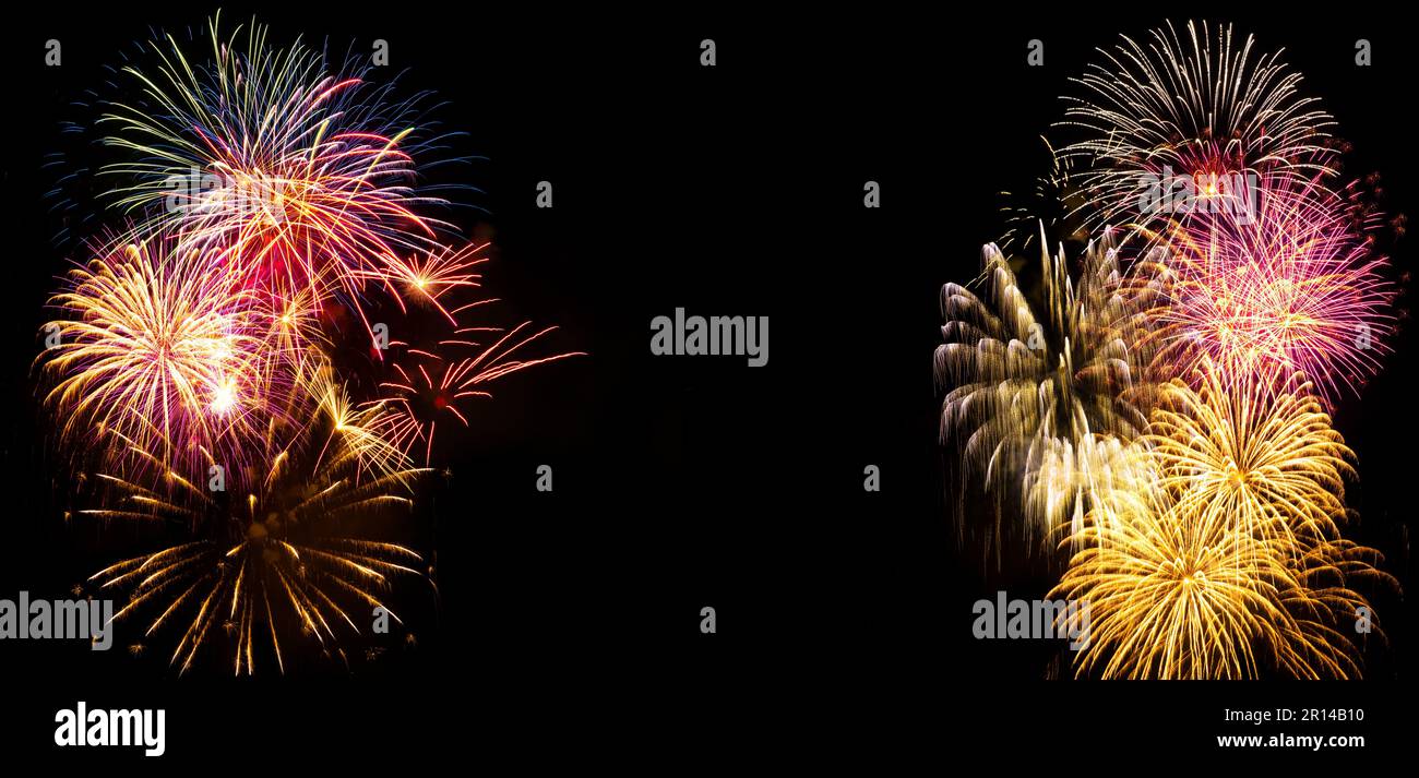 Fuochi d'artificio luminosi e colorati su sfondo nero. Sfondo per celebrazioni di compleanno, grandi eventi e feste Foto Stock