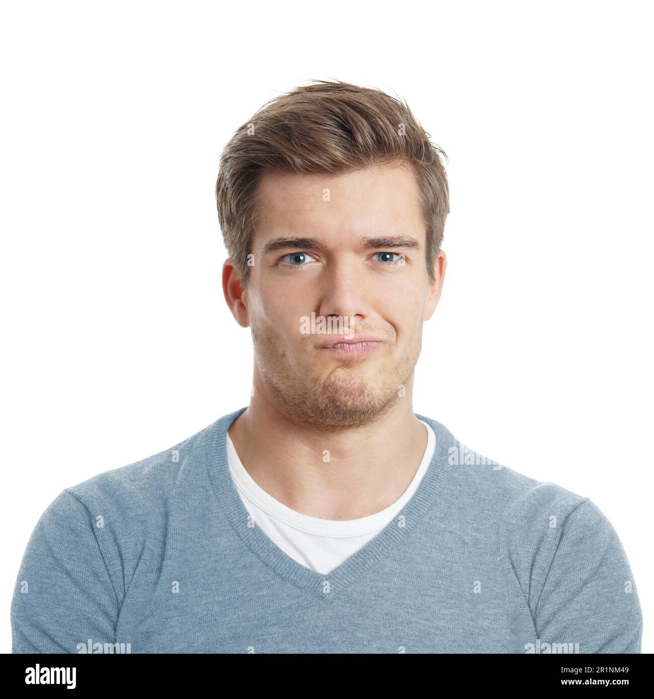un giovane dispiaciuto o scettico sta facendo un volto Foto Stock