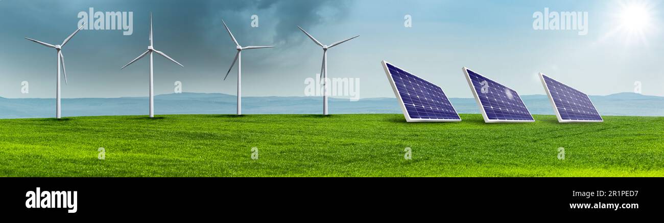 Turbine eoliche e celle solari su un campo verde in un paesaggio collinare Foto Stock