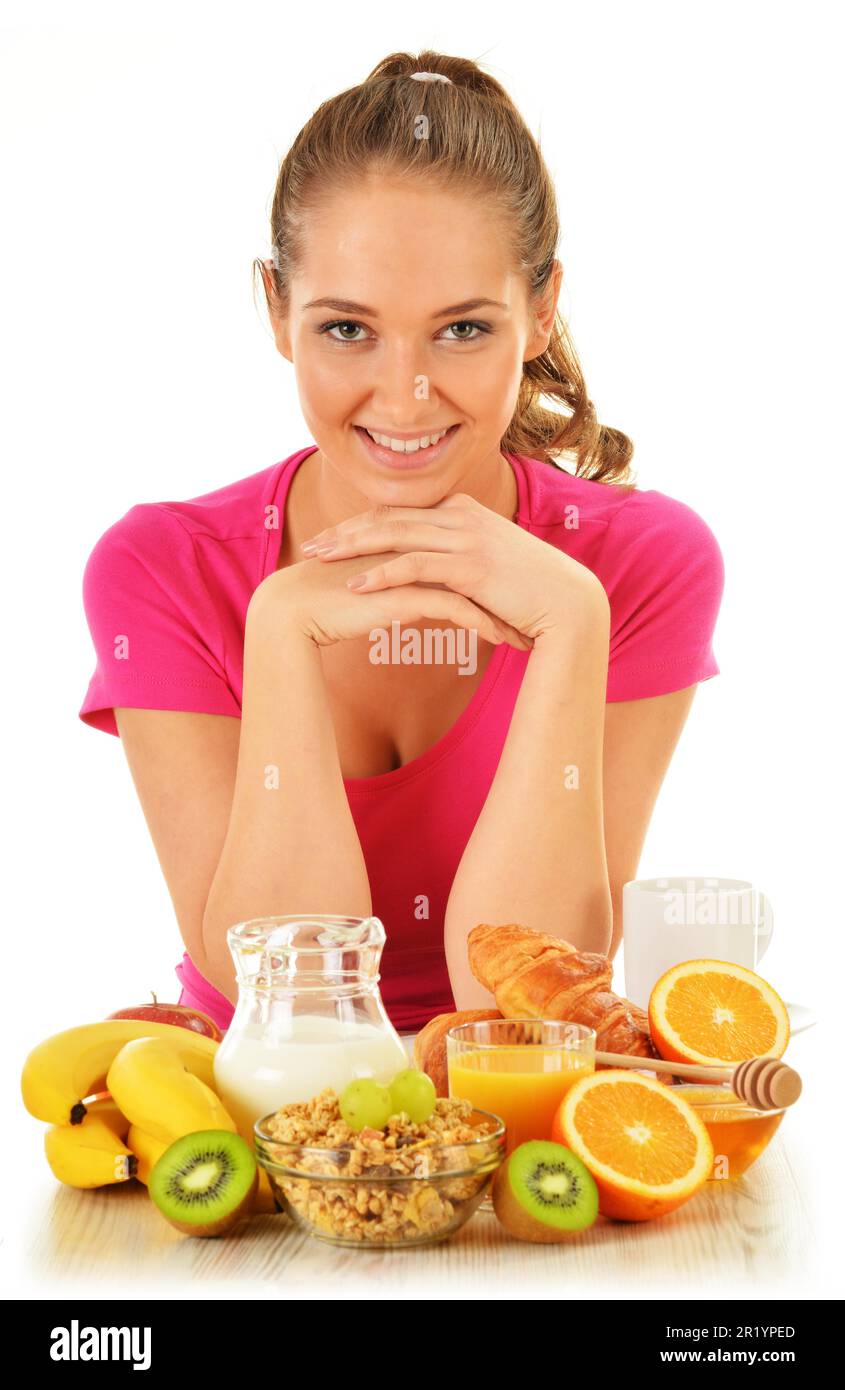 Giovane donna con prima colazione. Alimentazione equilibrata Foto Stock