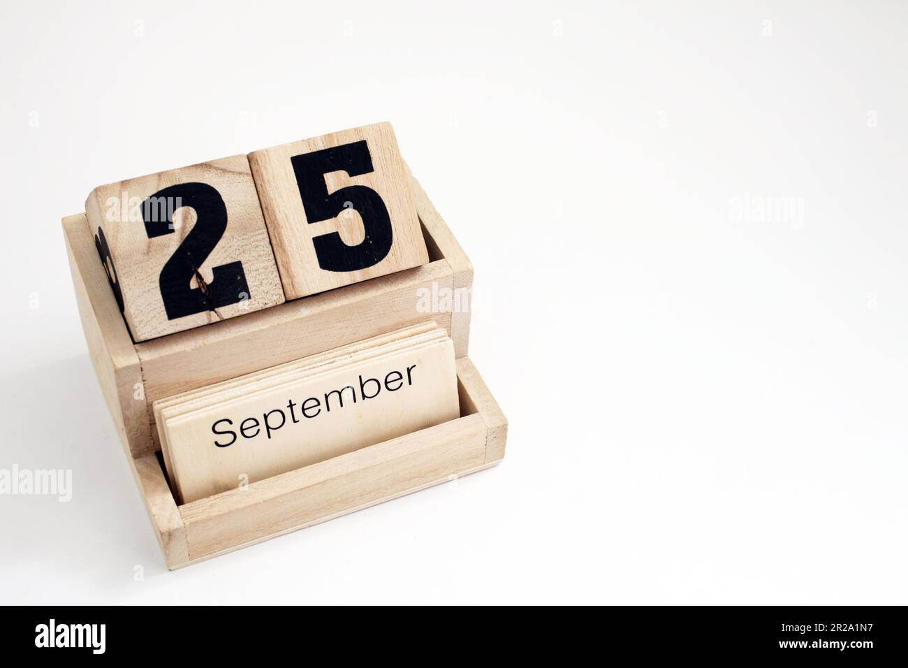 Calendario perpetuo in legno che mostra il 25th settembre Foto Stock