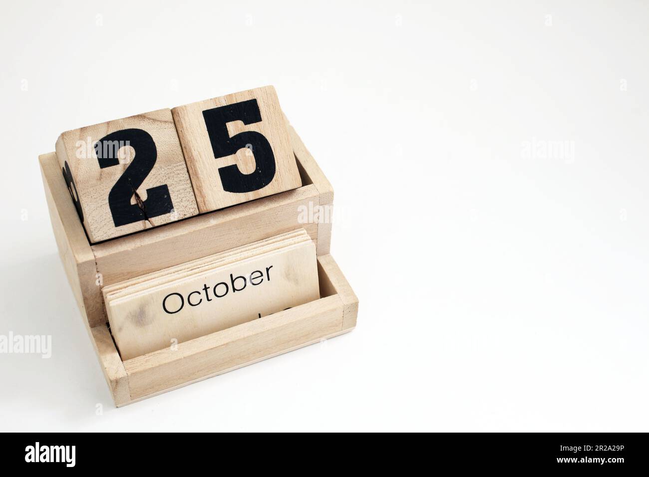 Calendario perpetuo in legno che mostra il 25th ottobre Foto Stock