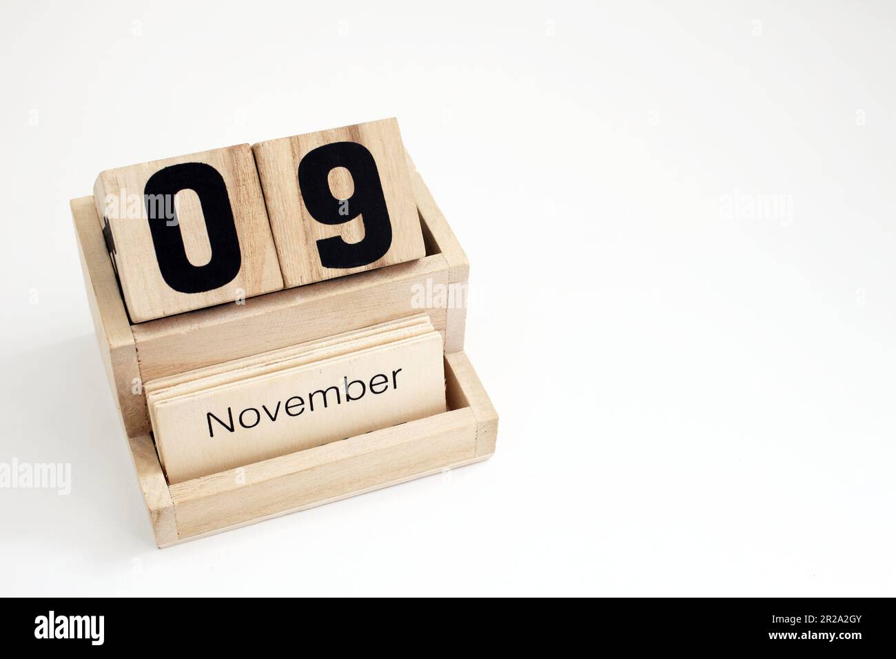 Calendario perpetuo di legno che mostra il 9th novembre Foto Stock