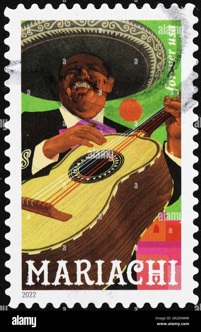 Mariachi con la sua chitarra su francobollo americano Foto Stock