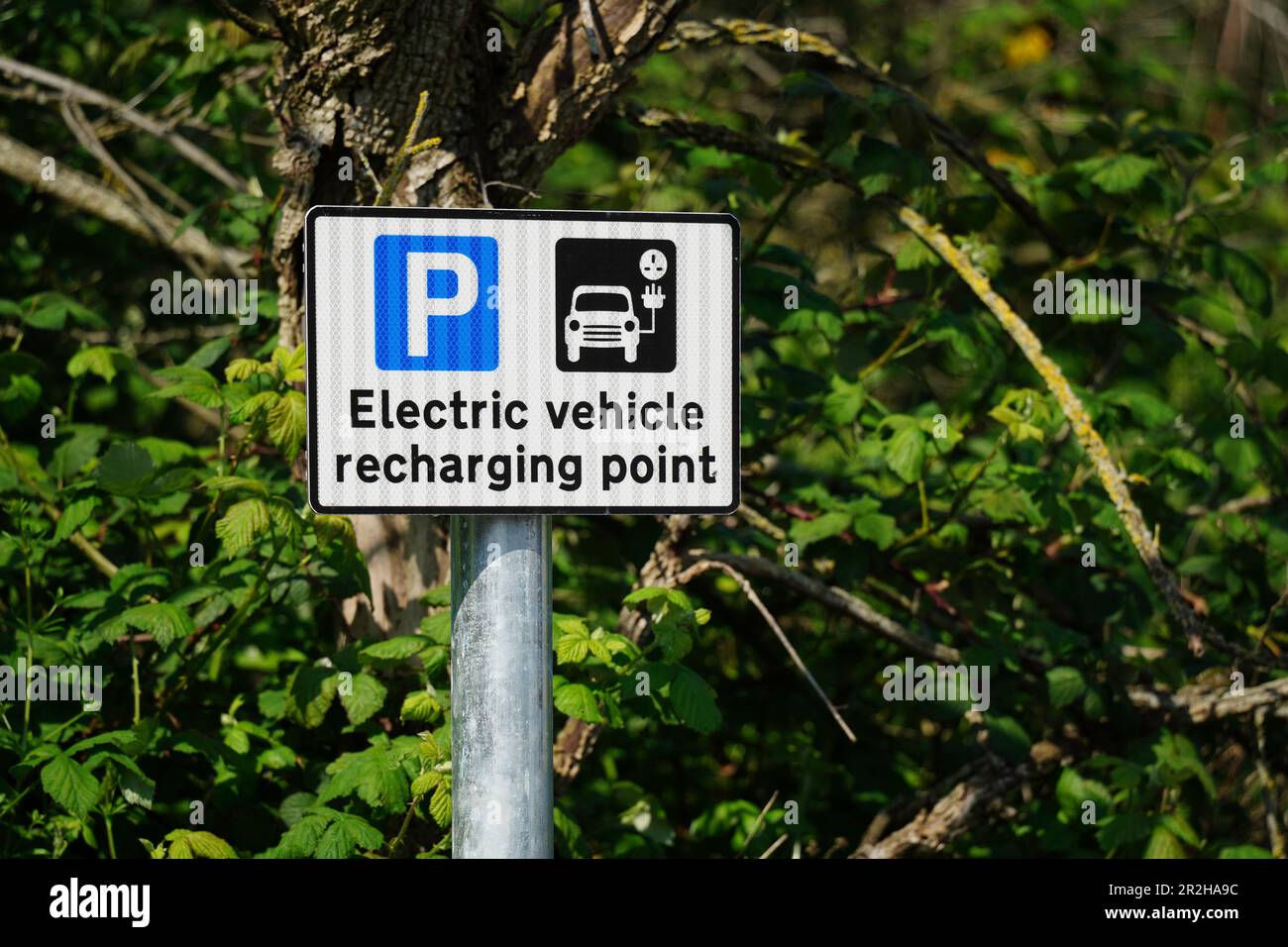 Cartello punto ricarica auto elettrica Foto Stock