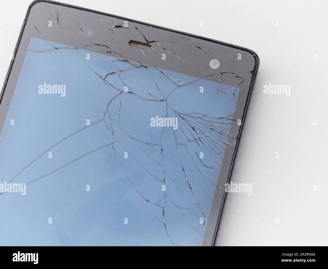 Primo piano dello schermo dello smartphone incrinato Foto Stock