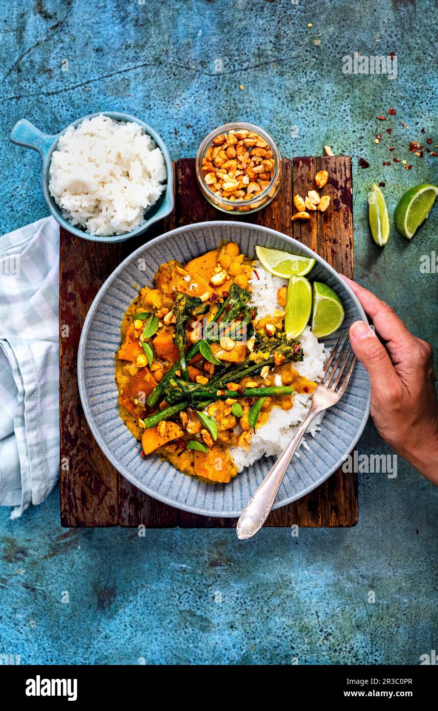 Patate al curry dolce satay Foto Stock
