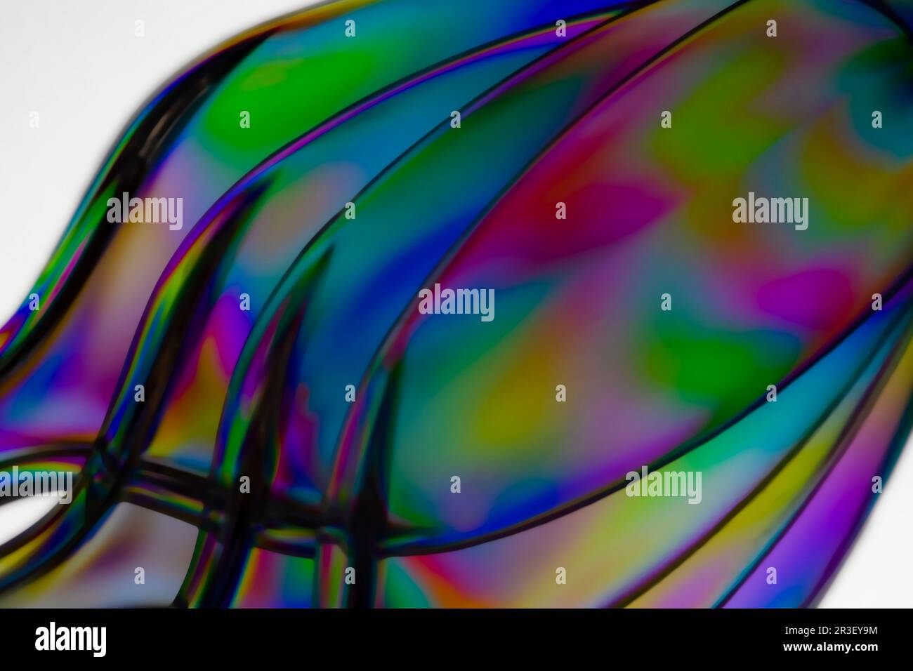 Luce polarizzata attraverso l'astratto di utensili in plastica trasparente Foto Stock