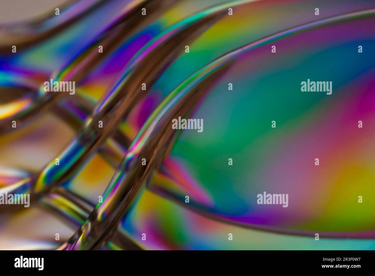 Luce polarizzata attraverso l'astratto di utensili in plastica trasparente Foto Stock