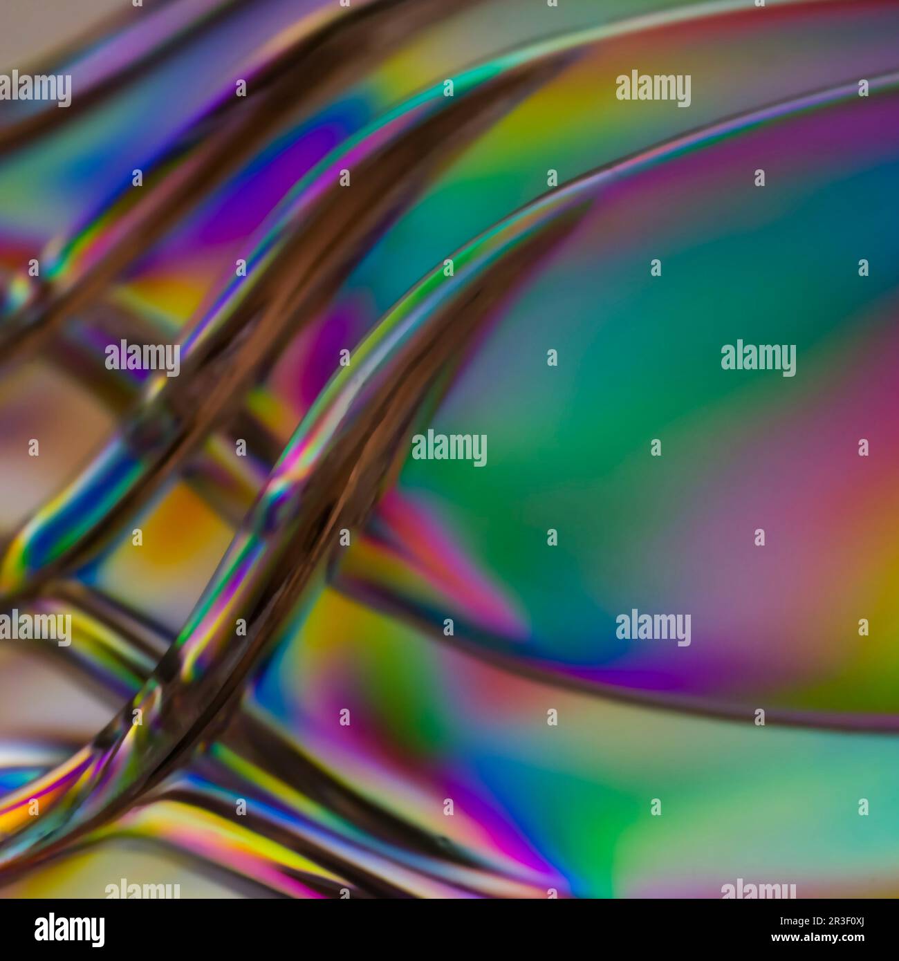 Luce polarizzata attraverso l'astratto di utensili in plastica trasparente Foto Stock