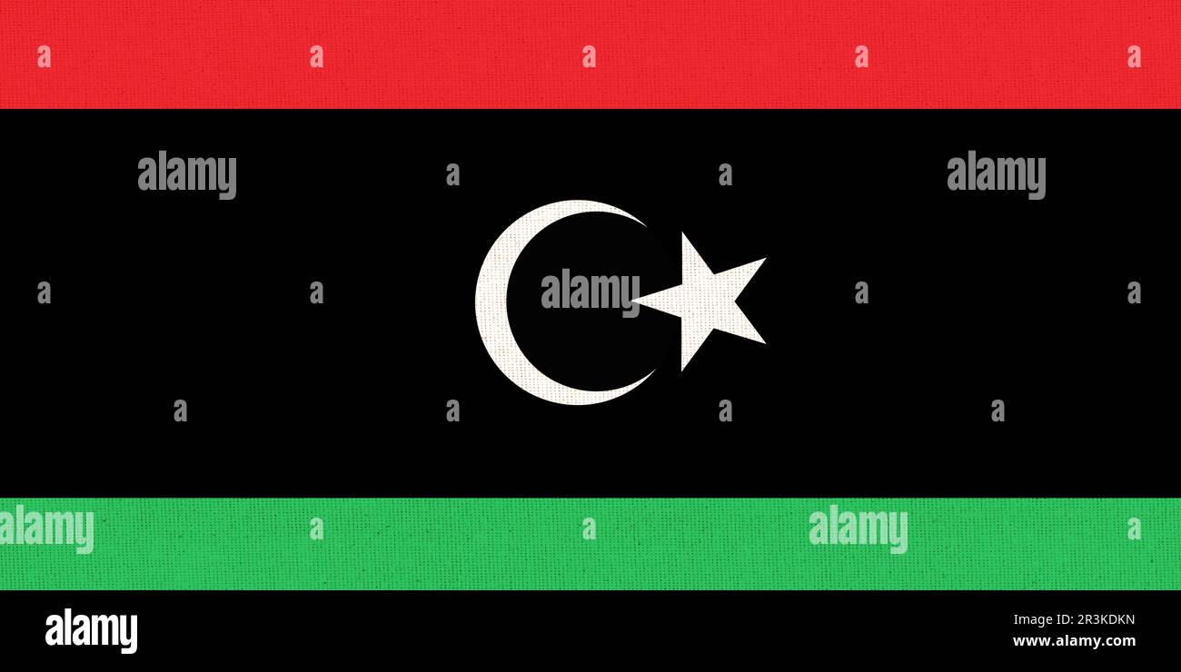 Bandiera della Libia. Bandiera libica sulla superficie del tessuto. Struttura del tessuto. Stato della Libia. Simbolo di stato libico. A. Foto Stock