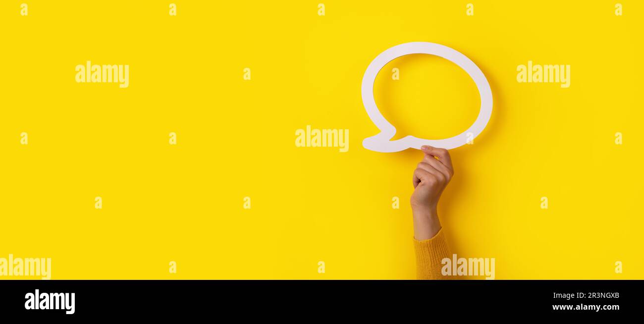 Bolla di dialogo con mano Foto Stock