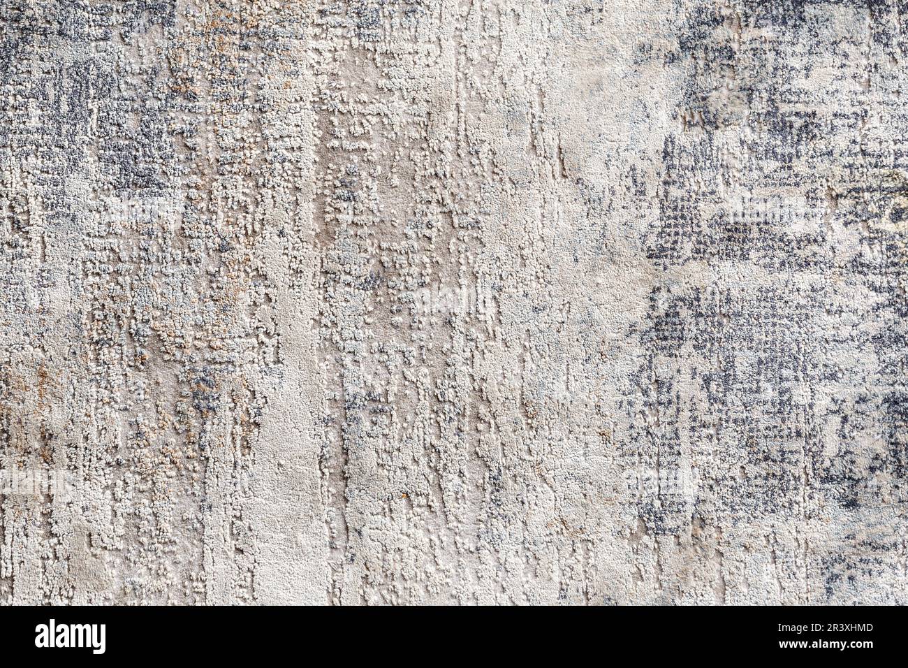 Texture di un tappeto naturale con un motivo astratto, primo piano. Moquette moderna, stoffa di moquette, disegno, stampa, fondo di moquette del pavimento, design degli interni Foto Stock