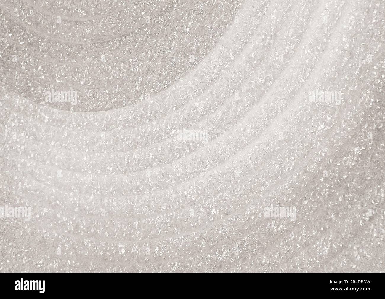 Schiuma bianca in un rotolo primo piano, edificio, materiale isolante tessuto sfondo. Foto Stock