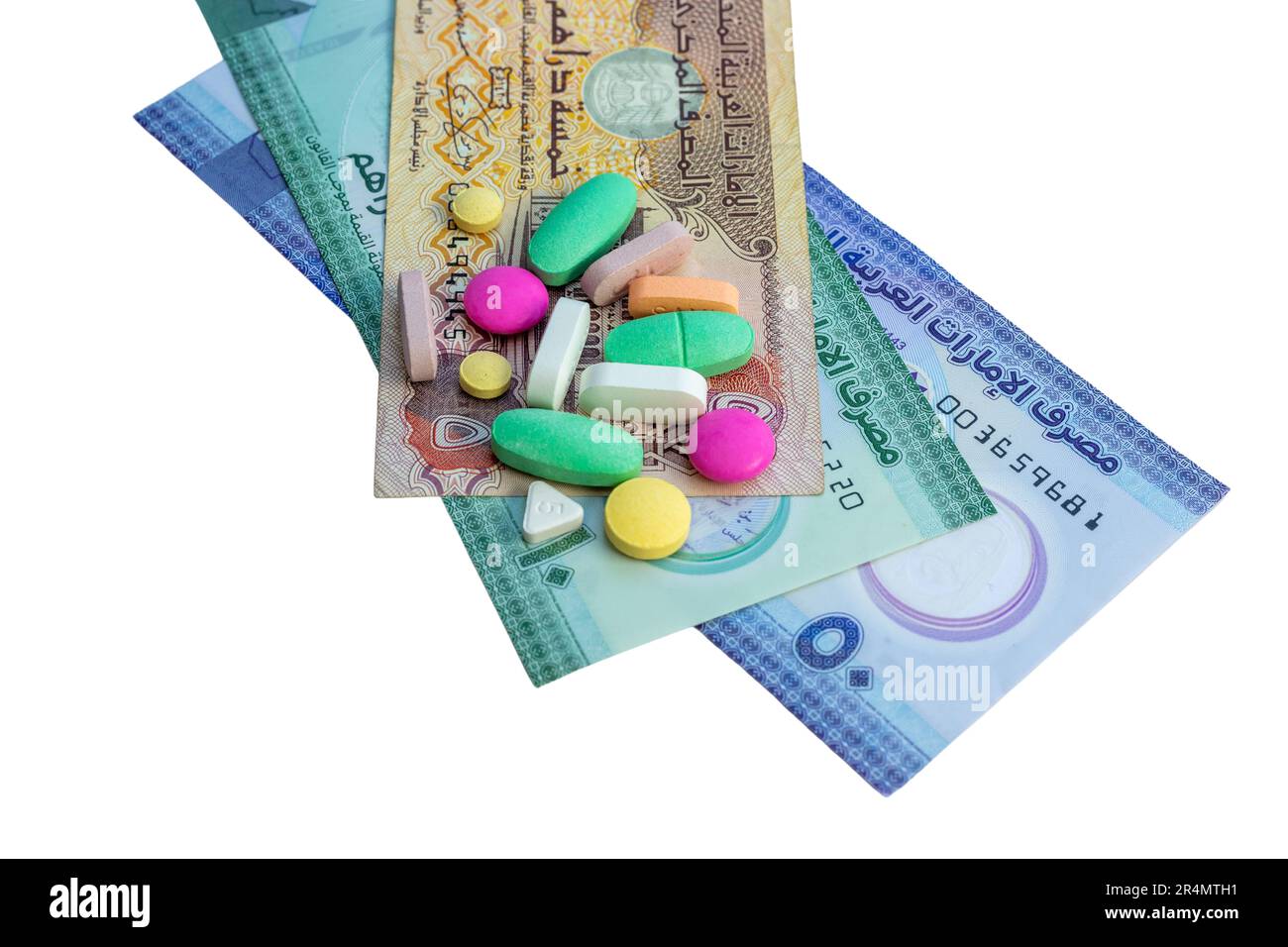 Pillole mediche e dirhams Emirati Arabi Uniti note isolate su sfondo bianco Foto Stock