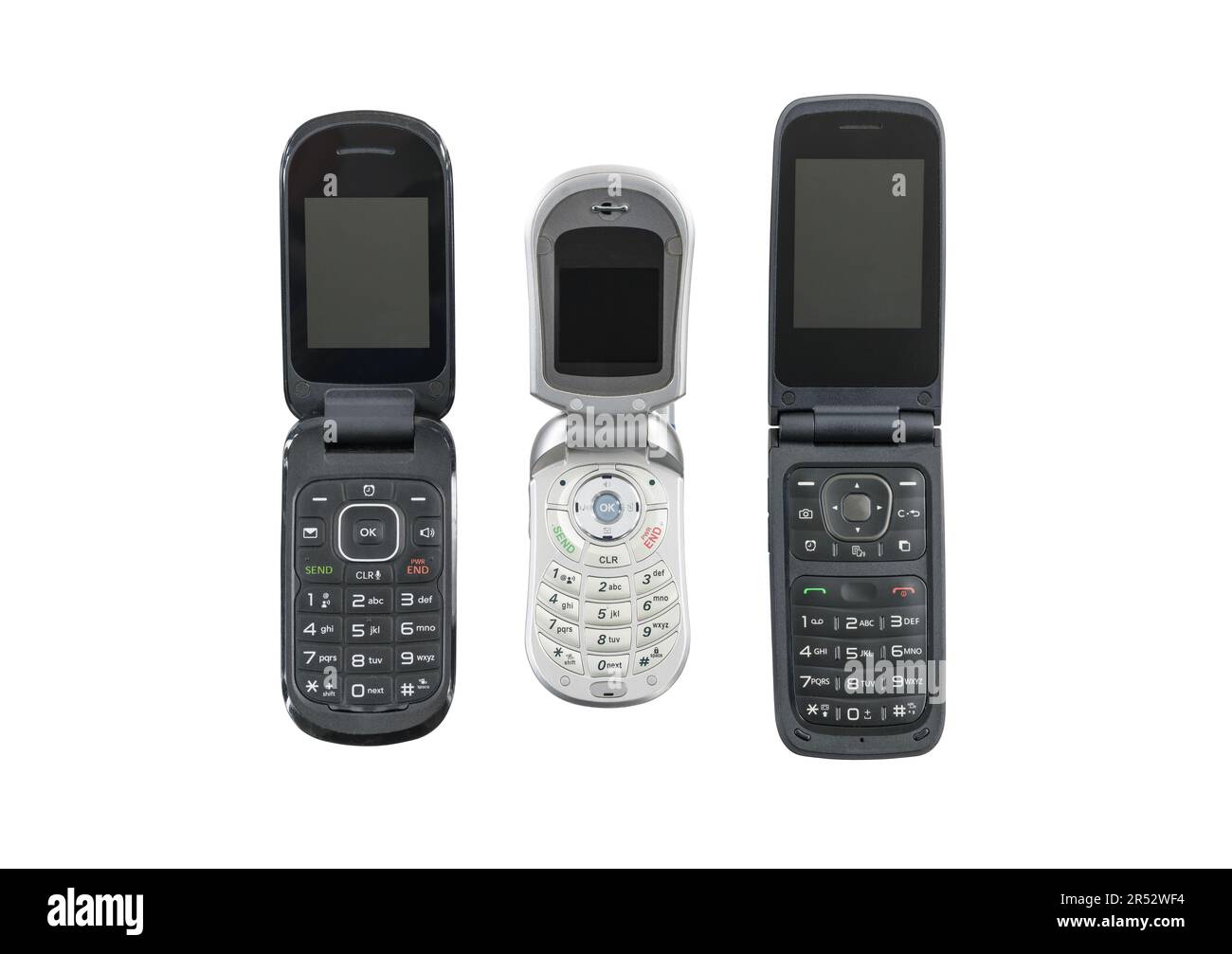 Tre vecchi telefoni cellulari a scatto isolati con sfondo ritagliato. Foto Stock