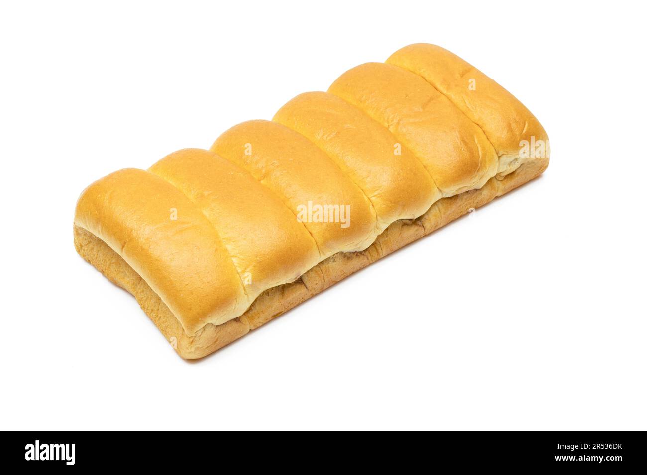 Pila dorata di panini lattiginosi isolati su sfondo bianco Foto Stock