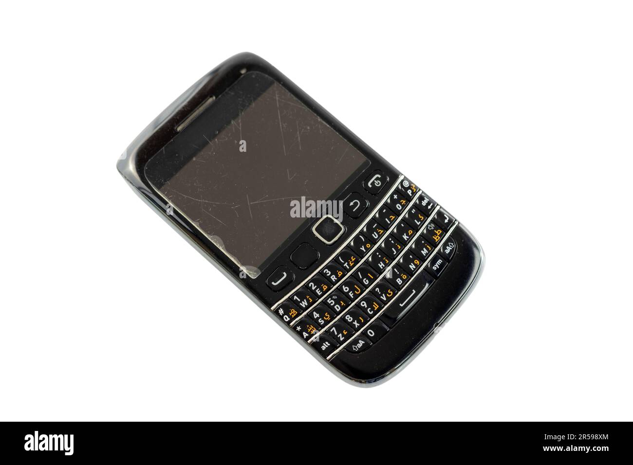 Telefono cellulare nero vecchio stile con tastiera tasti fisici su sfondo bianco isolato. Foto Stock