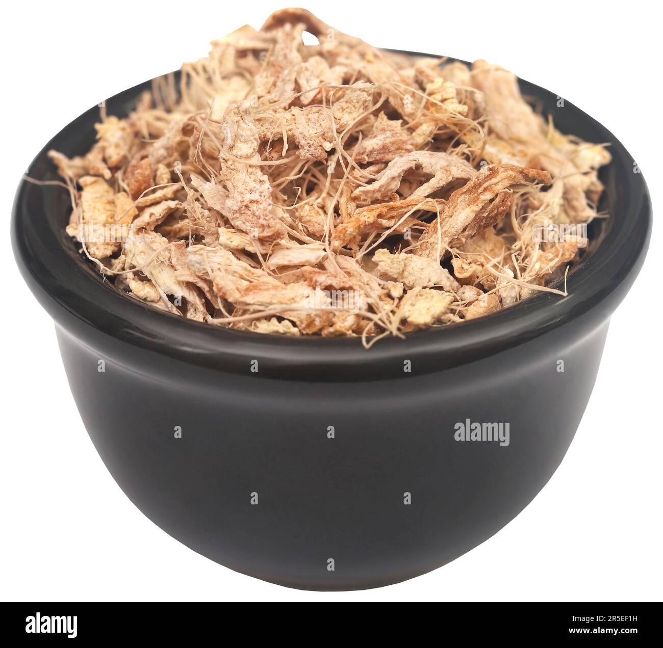 Lo zenzero affettato e essiccato in una ciotola Foto Stock