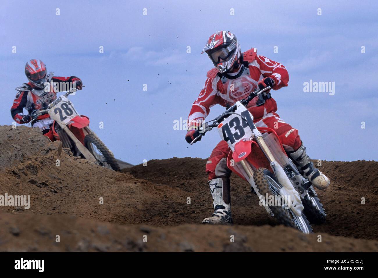 Il pilota Motorcross prende il turno Foto Stock