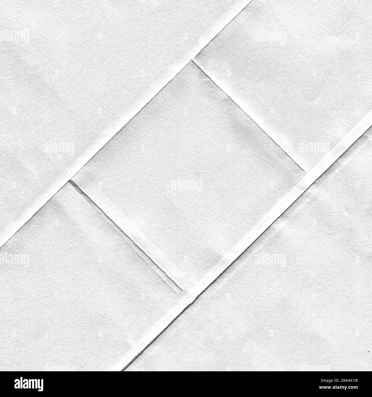 Grana di carta bianca con pieghe inclinate Foto Stock